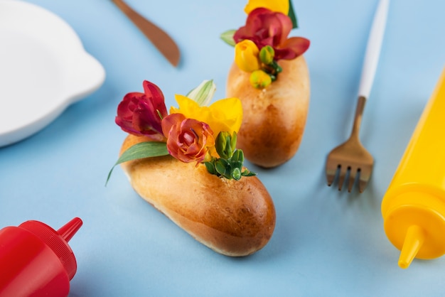 high-angle-eco-hot-dogs-with-flowers_23-2149453842